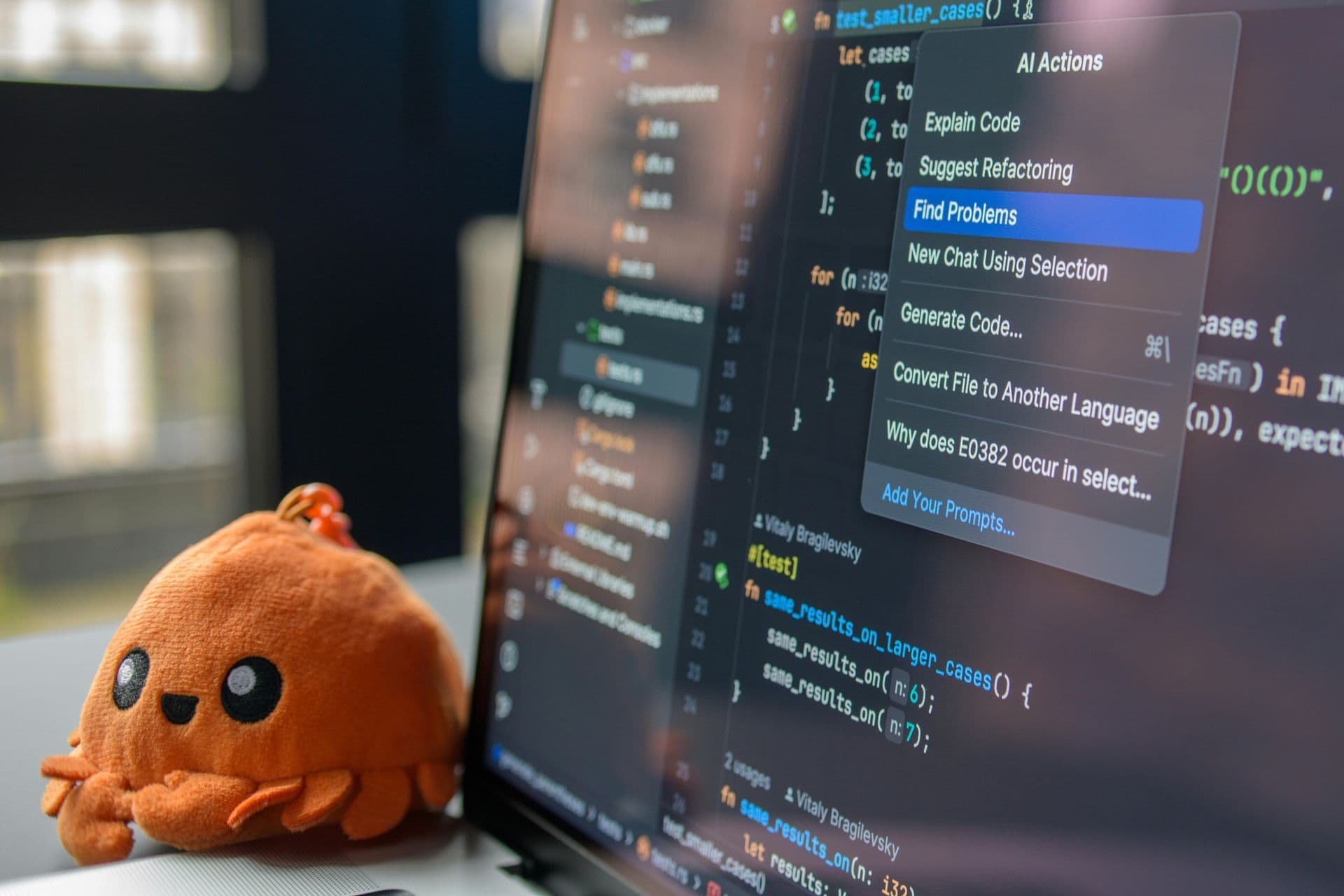 Crab plush with code on monitor